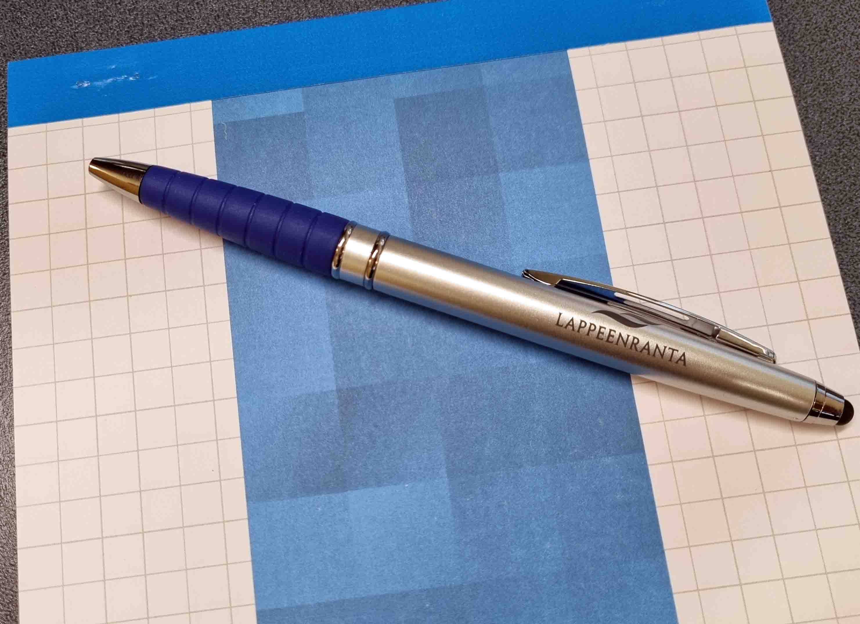 a notepad and a pen.